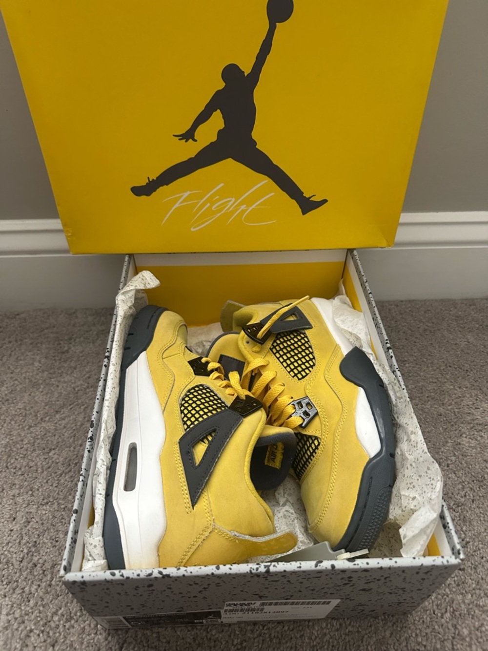Jordan Yellow and Black Retro 4 Sneakers